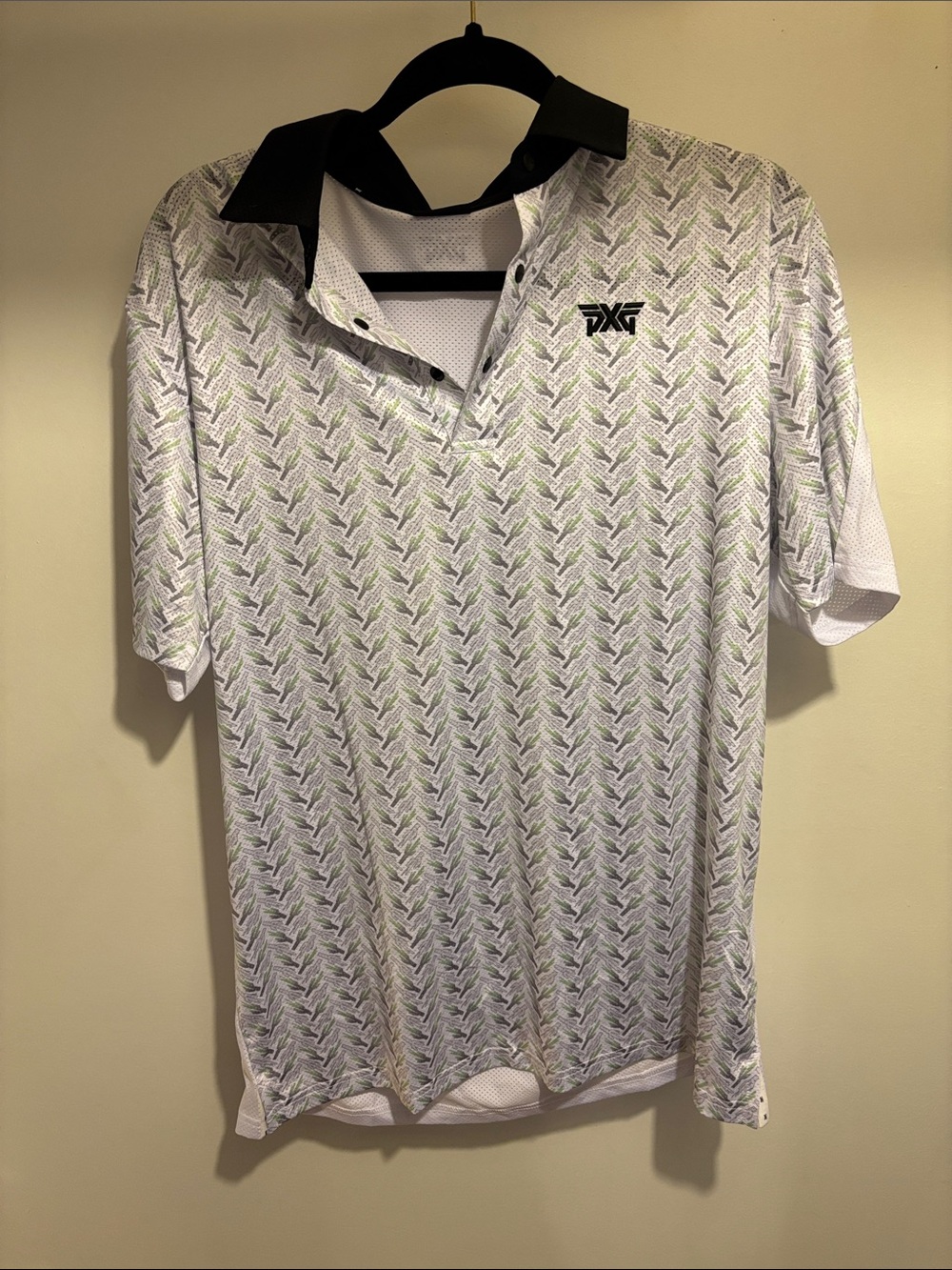 PXG White Polo with Black Collar and Subtle Green Pattern